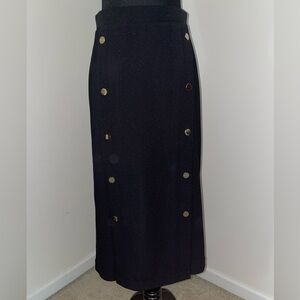Express mid length black skirt with gold buttons and two front slits, size XS.